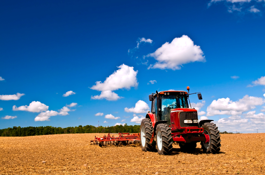 Tractor in plowed field